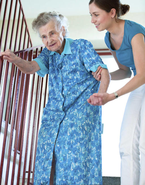 female-caregiver-helping-elderly-woman-on-stairs-512w Hospital to Home transition care
