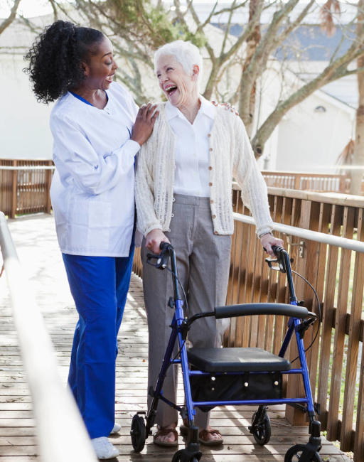 female-caregiver-senior-woman-walker-512w Senior Living woman walker Dekalb, IL
